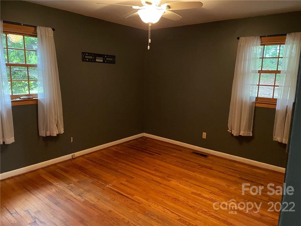 612 Mcdade Road Tryon, NC 28782 - Photo 15 of 27 a view of empty room with wooden floor