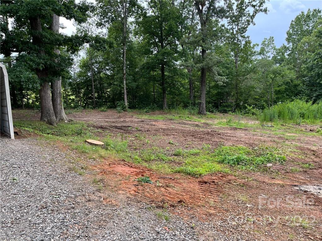 612 Mcdade Road Tryon, NC 28782 - Photo 24 of 27 a backyard of a house with lots of green space