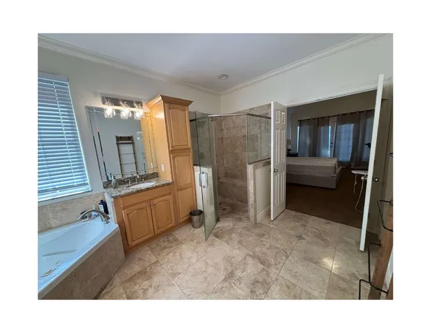 a living room with furniture and a walk in closet