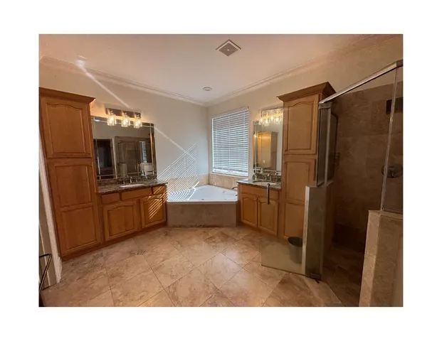 a kitchen with sink cabinets and stainless steel appliances