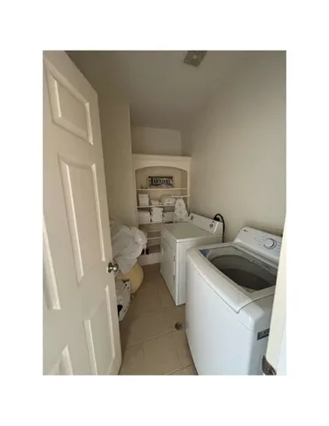 a bathroom with a toilet a sink and a mirror