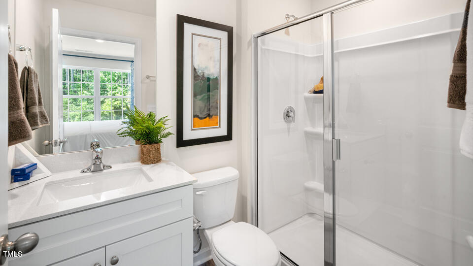 8519 Beckett Chase Way Raleigh, NC 27616 - Photo 18 of 29 a bathroom with a sink toilet and shower