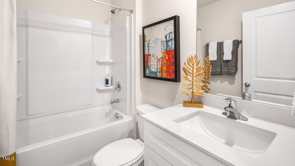 8519 Beckett Chase Way Raleigh, NC 27616 - Photo 21 of 29 a bathroom with a sink toilet and shower