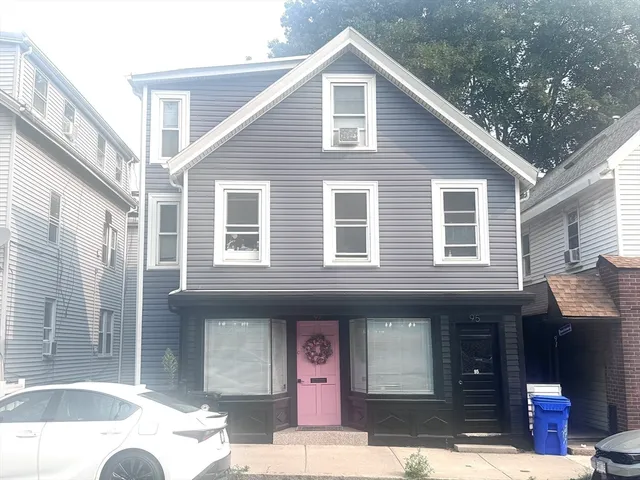 a front view of a house with glass windows