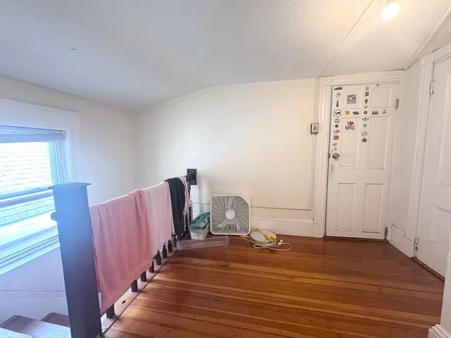a view of a livingroom with wooden floor