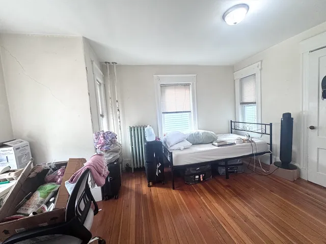 a workspace with furniture window and wooden floor