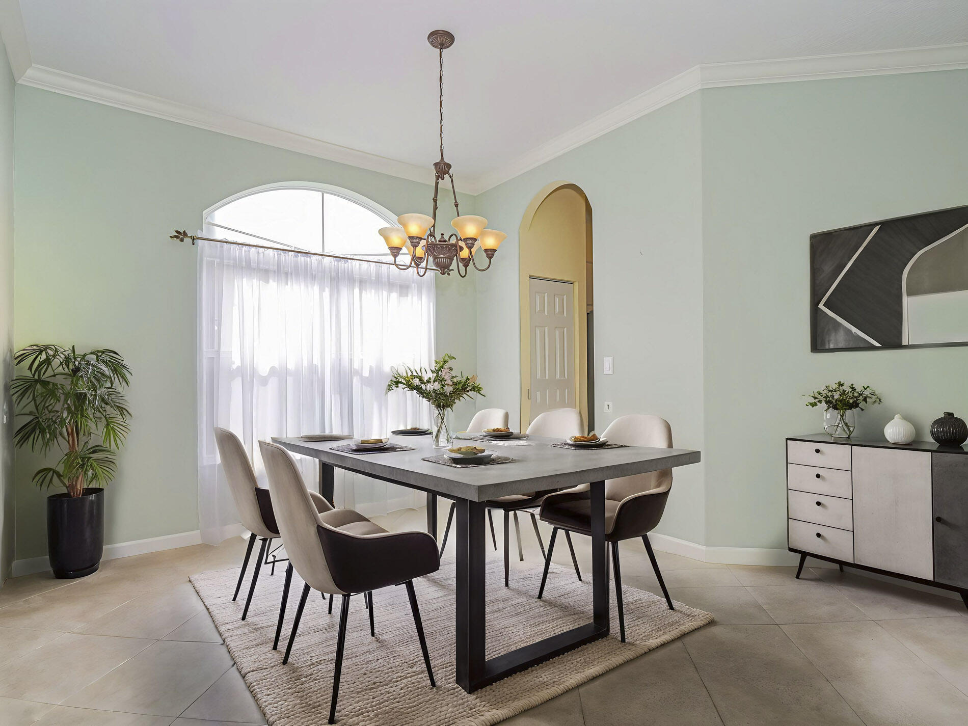 6871 Southeast Twin Oaks Circle Stuart, FL 34997 - Photo 12 of 34 a view of a dining room with furniture and chandelier