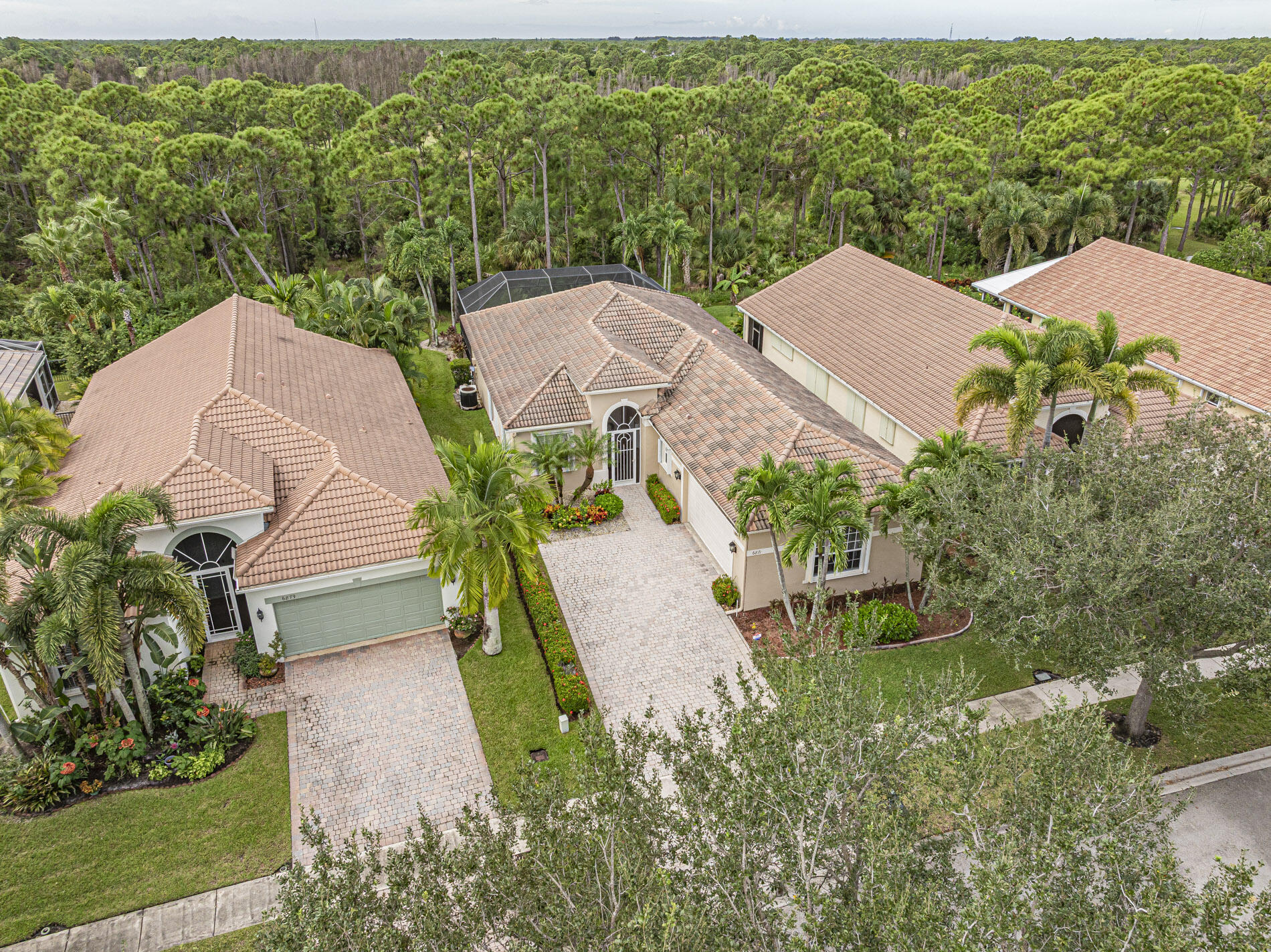 6871 Southeast Twin Oaks Circle Stuart, FL 34997 - Photo 28 of 34 an aerial view of a house with yard swimming pool and outdoor seating