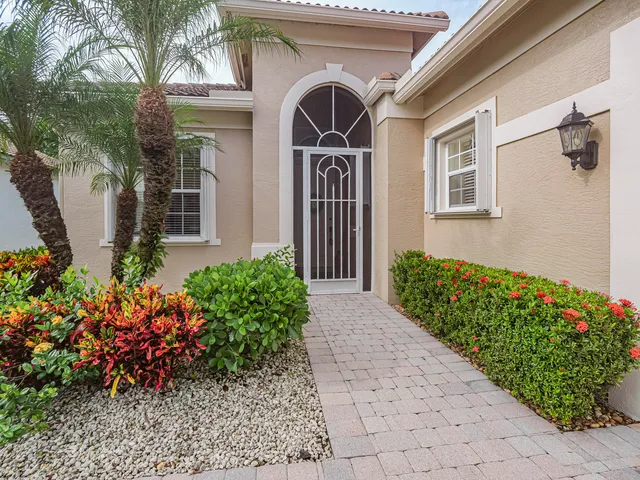 a view of a dining room with furniture large windows and wooden floor