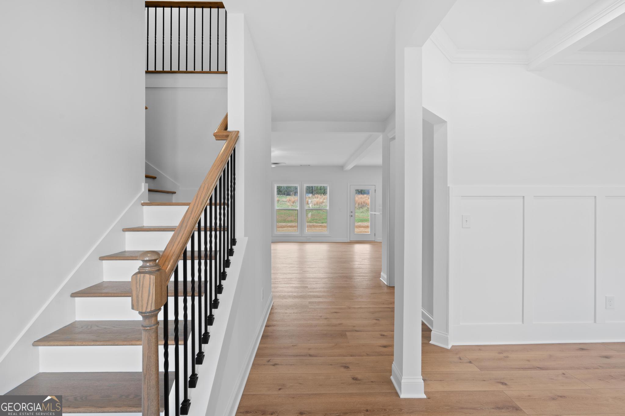 2305 New Hope Road, Unit (LOT 5) Locust Grove, GA 30248 - Photo 13 of 45 a view of a hallway with wooden floor and staircase