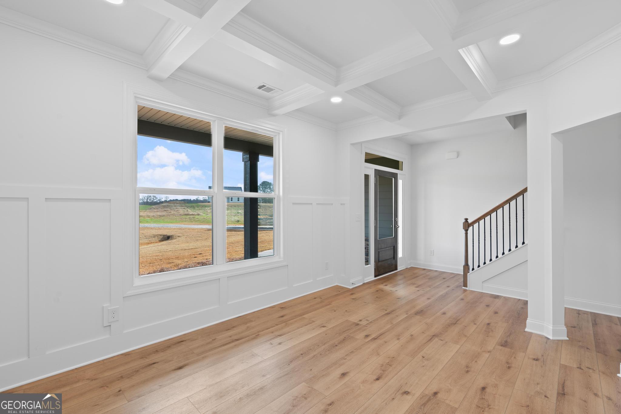 2305 New Hope Road, Unit (LOT 5) Locust Grove, GA 30248 - Photo 15 of 45 a view of an empty room with wooden floor and a window