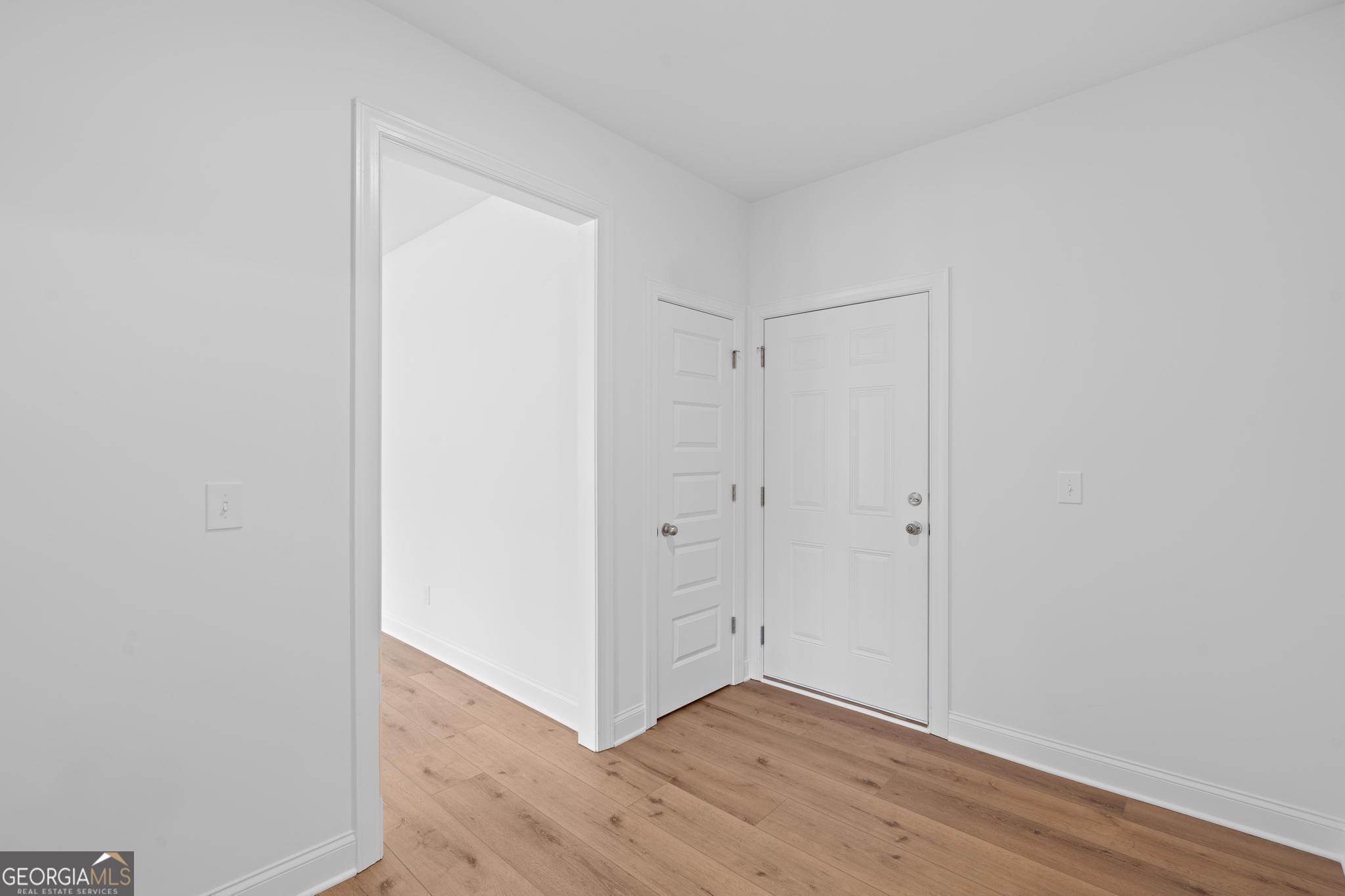 2305 New Hope Road, Unit (LOT 5) Locust Grove, GA 30248 - Photo 24 of 45 a view of an empty room with wooden floor