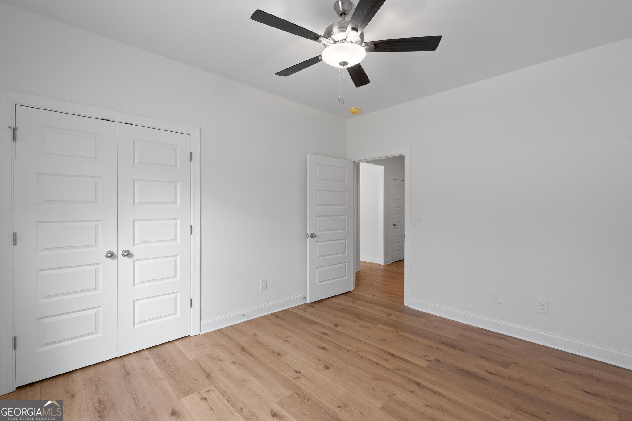 2305 New Hope Road, Unit (LOT 5) Locust Grove, GA 30248 - Photo 27 of 45 a view of empty room with wooden floor