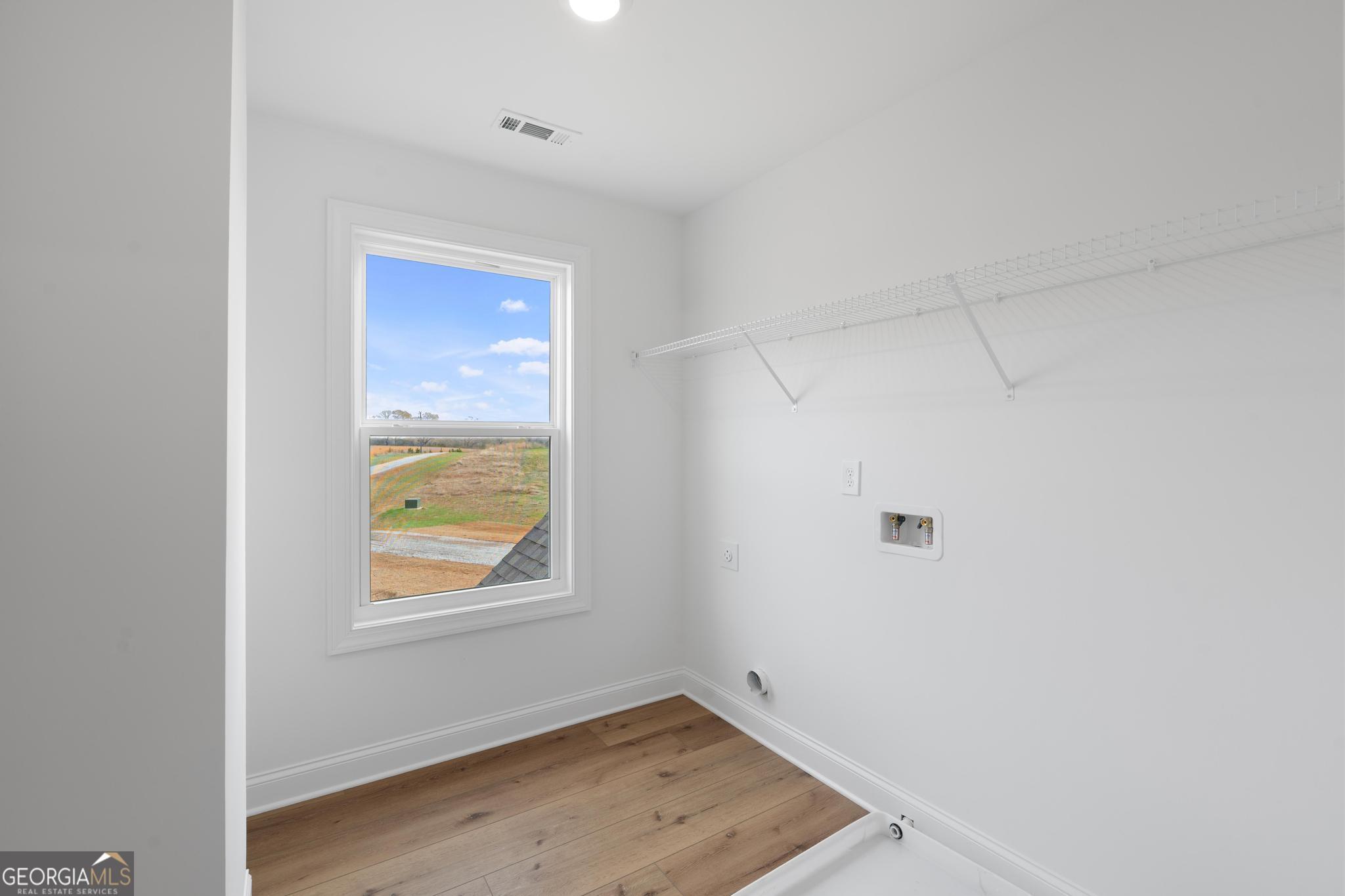 2305 New Hope Road, Unit (LOT 5) Locust Grove, GA 30248 - Photo 37 of 45 a view of room with window and closet