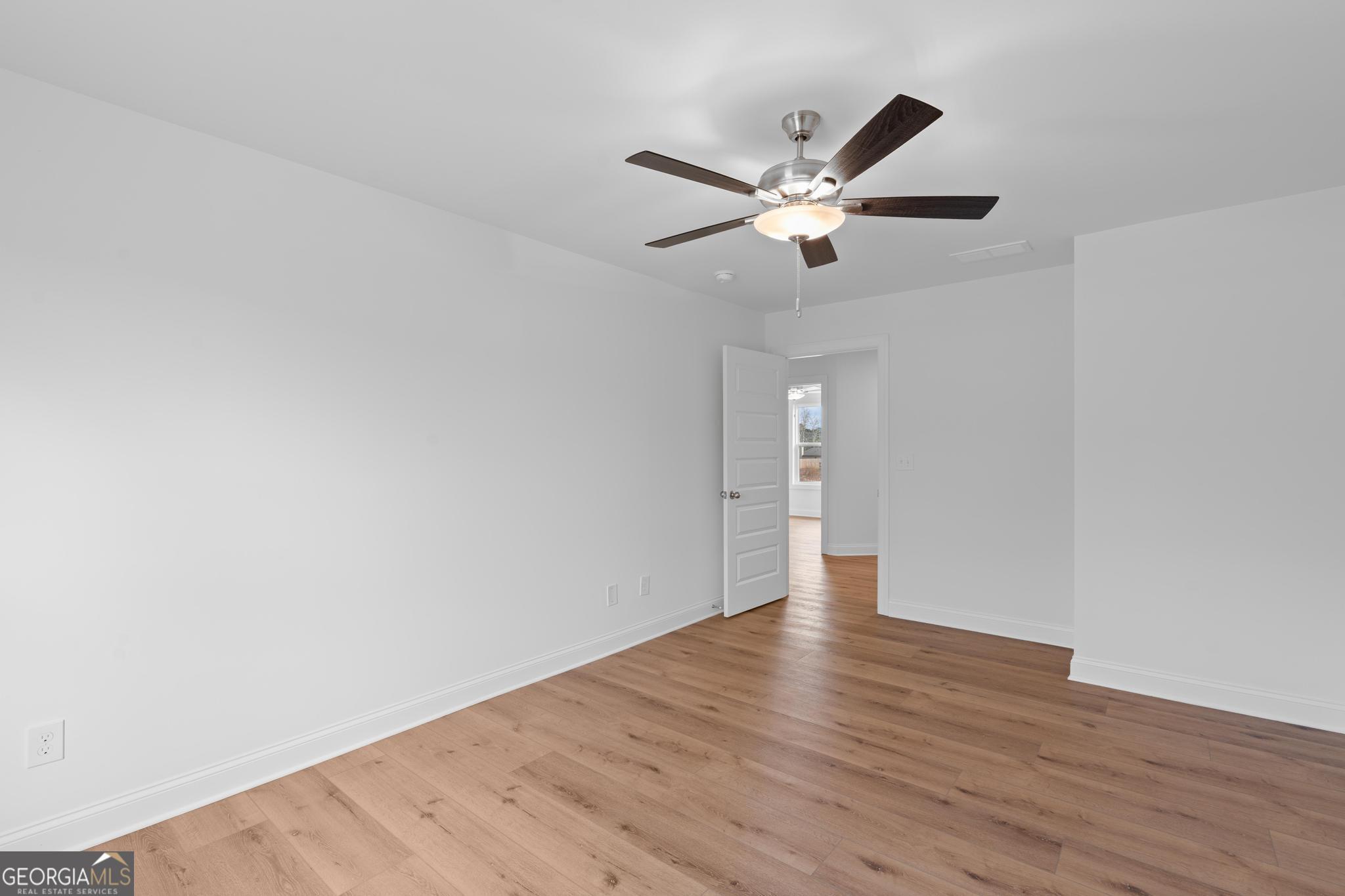 2305 New Hope Road, Unit (LOT 5) Locust Grove, GA 30248 - Photo 39 of 45 a view of an empty room with wooden floor