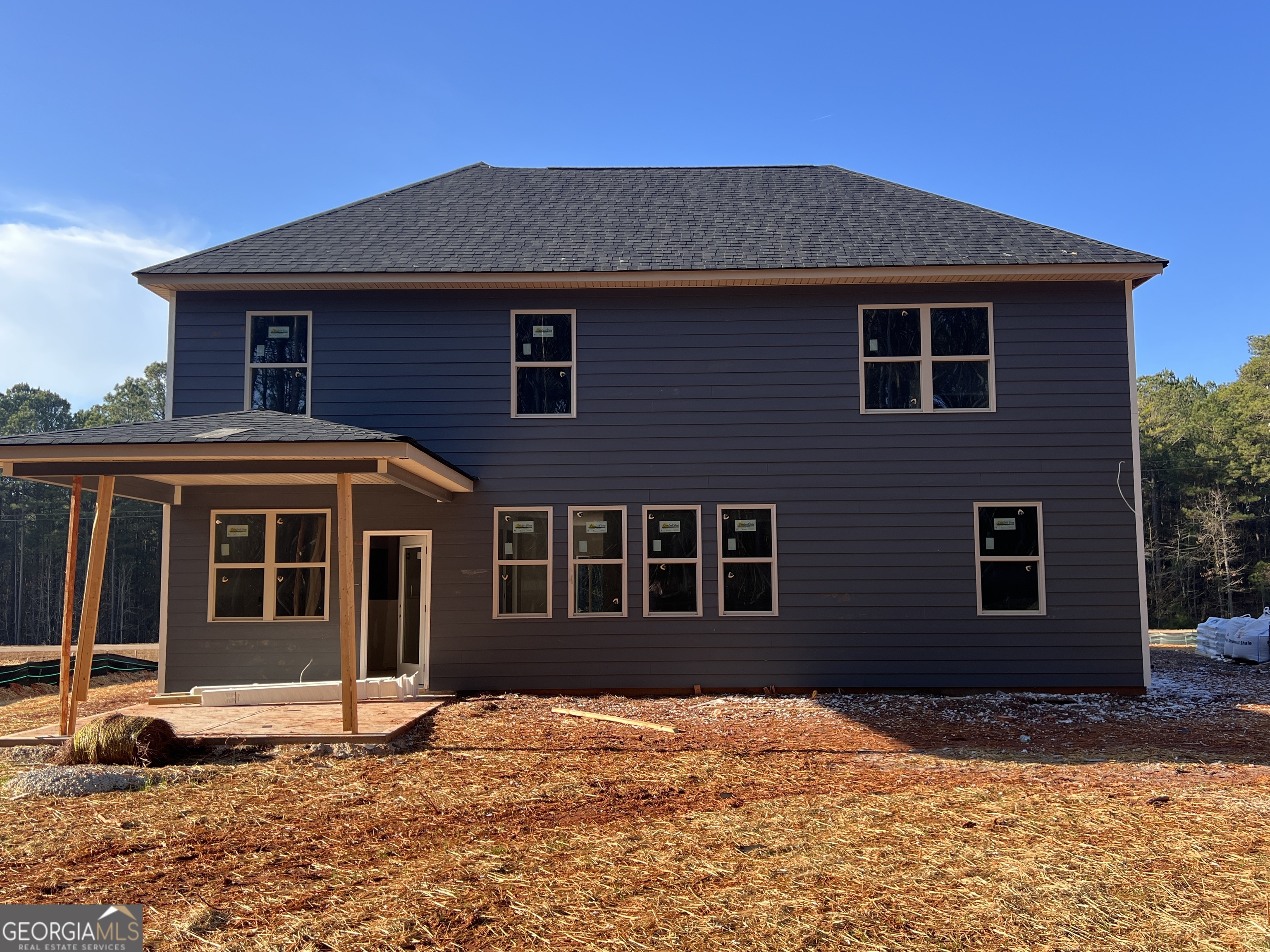 2305 New Hope Road, Unit (LOT 5) Locust Grove, GA 30248 - Photo 4 of 45 a house with yard in front of it