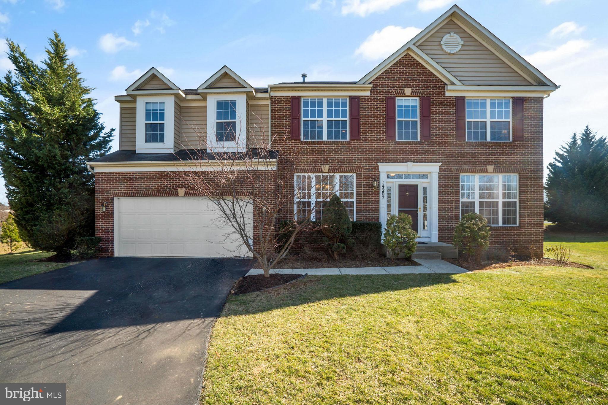 14202 Brass Wheel Road Boyds, MD 20841 - Photo 1 of 27 a front view of a house with a yard