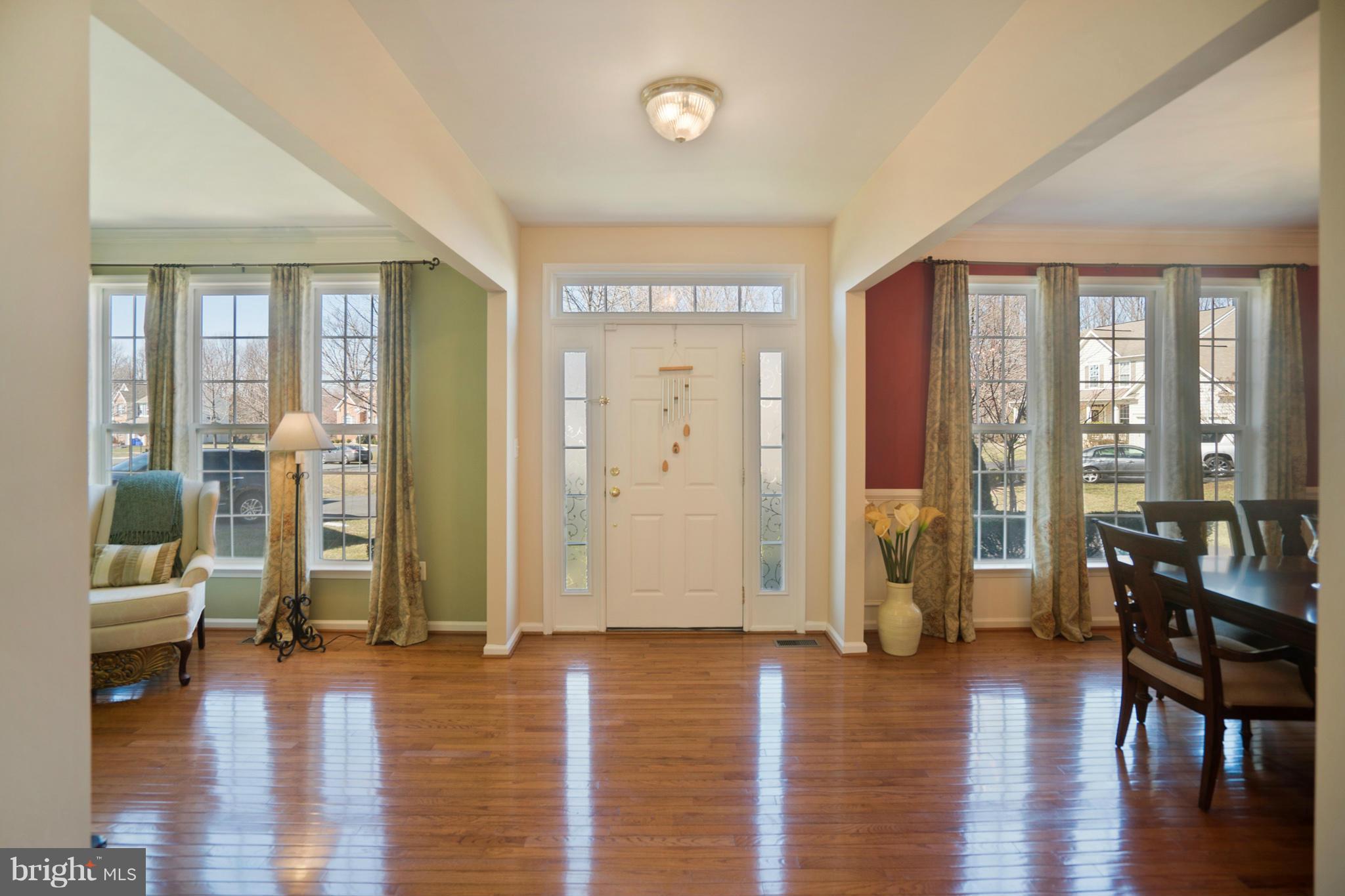 14202 Brass Wheel Road Boyds, MD 20841 - Photo 2 of 27 a view of a livingroom with furniture and hardwood floor