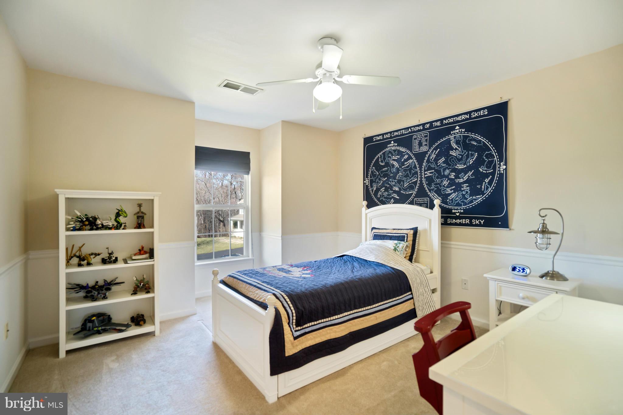 14202 Brass Wheel Road Boyds, MD 20841 - Photo 20 of 27 a bedroom with a bed and a cabinets
