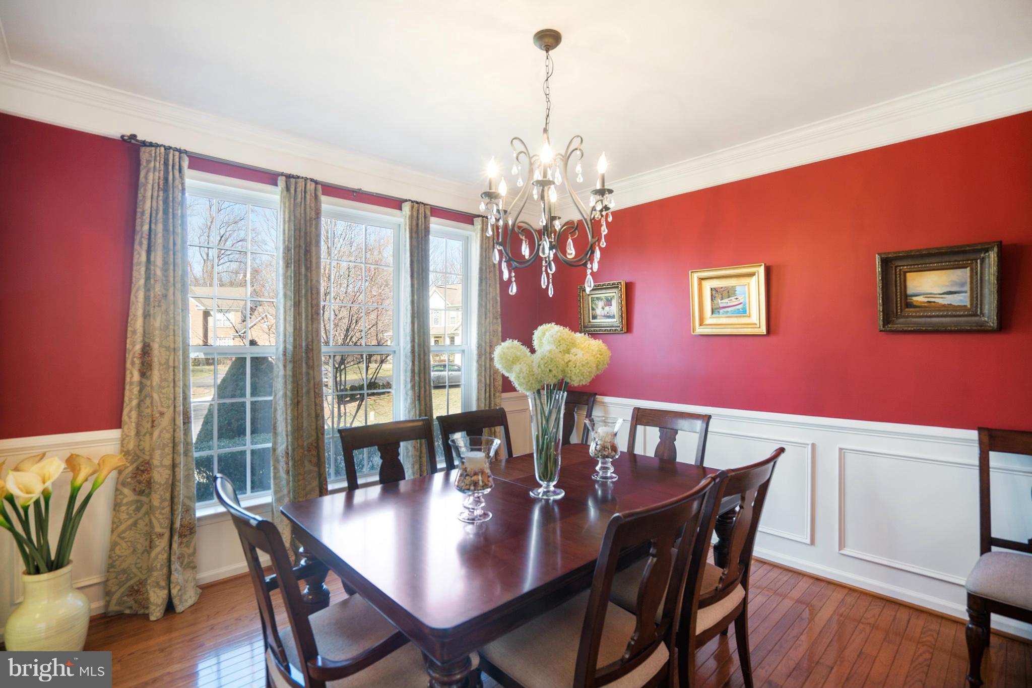 14202 Brass Wheel Road Boyds, MD 20841 - Photo 3 of 27 a view of a dining room with furniture window and wooden floor