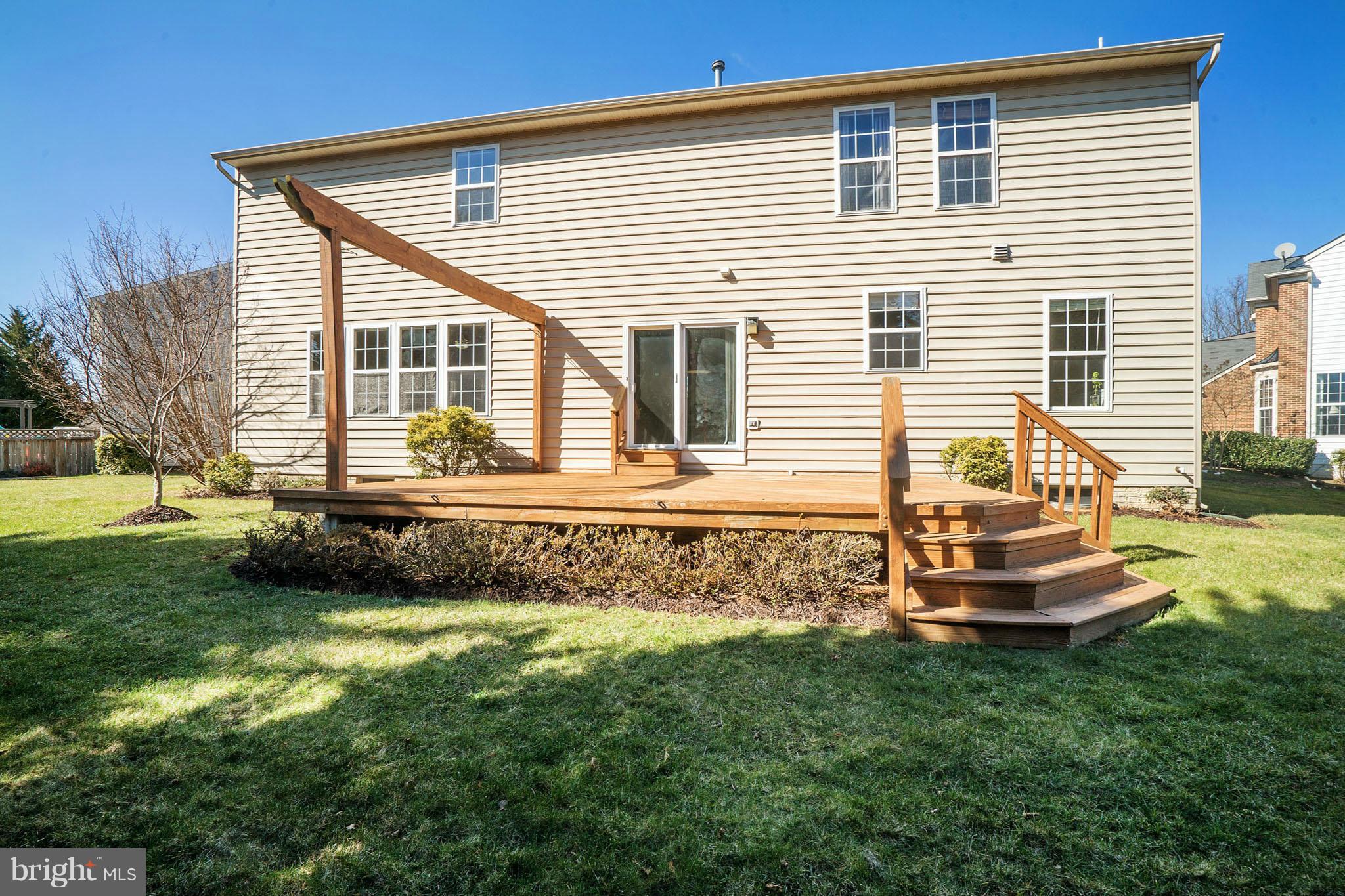 14202 Brass Wheel Road Boyds, MD 20841 - Photo 27 of 27 a front view of a house with a garden