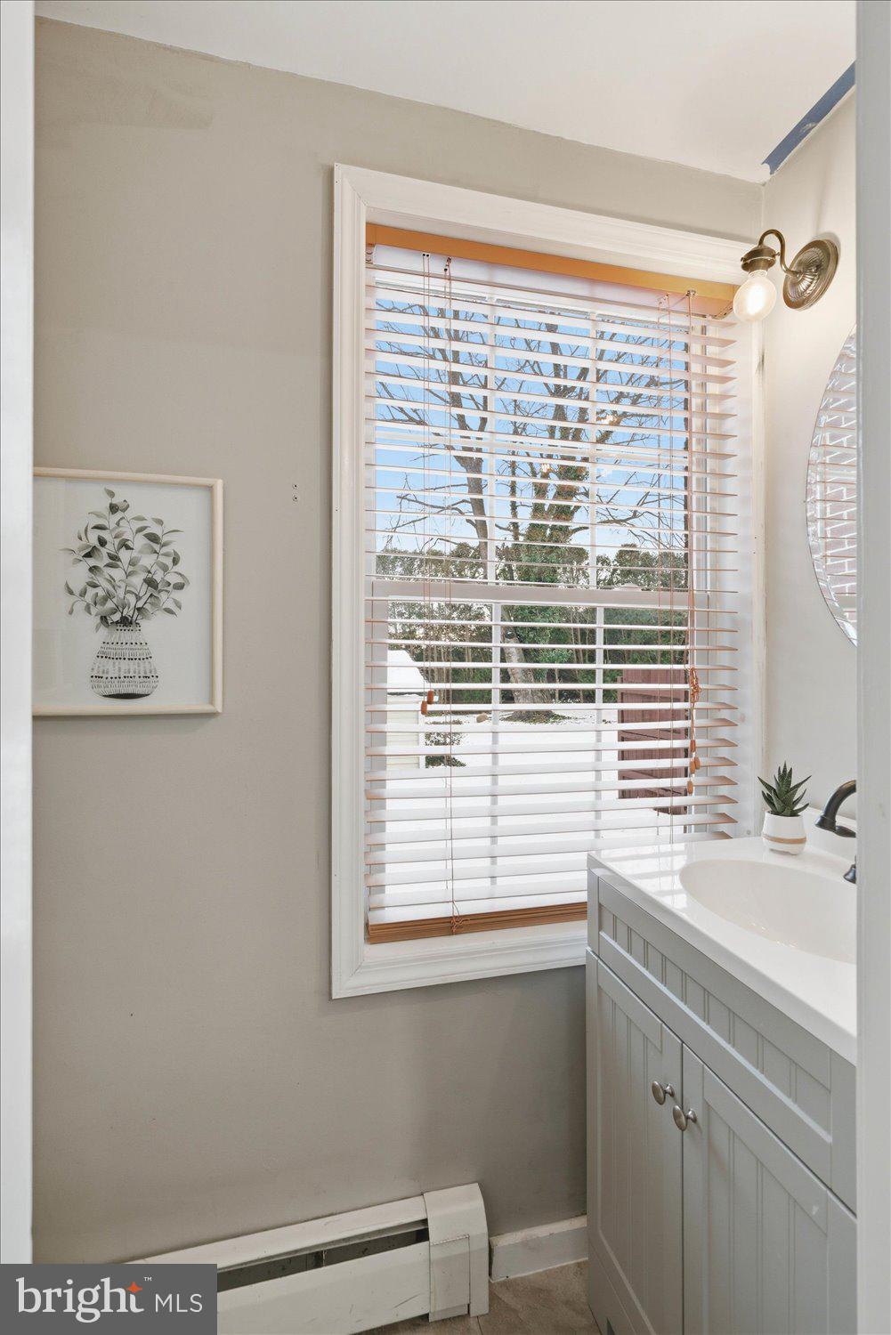 845 Paramount Avenue Lancaster, PA 17602 - Photo 23 of 49 a bathroom with a sink a mirror and a window