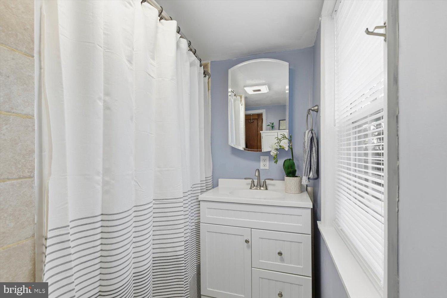 845 Paramount Avenue Lancaster, PA 17602 - Photo 36 of 49 a bathroom with a sink and a mirror