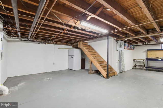 a view of an empty room with stairs