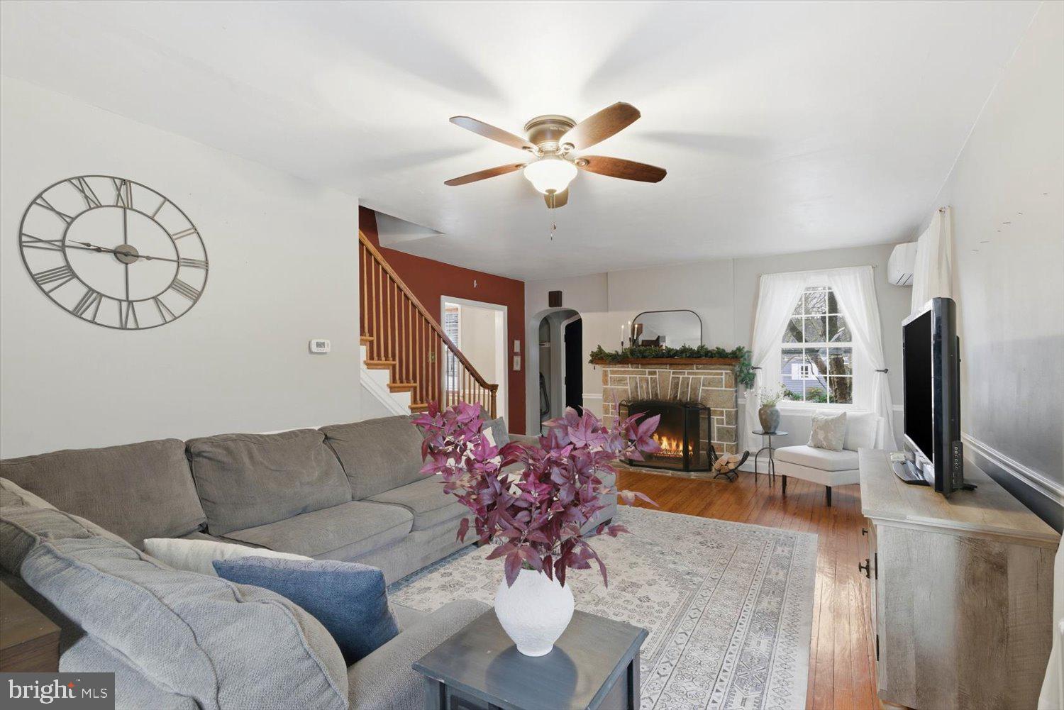 845 Paramount Avenue Lancaster, PA 17602 - Photo 9 of 49 a living room with furniture a fireplace and a flat screen tv