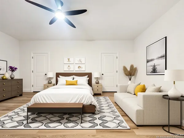 a bedroom with a bed and wooden floor