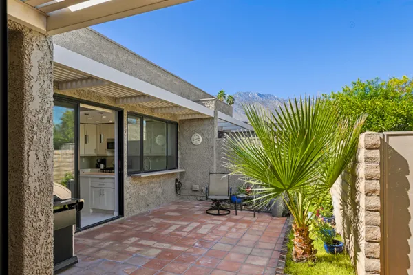 a view of a potted plants in front of a house