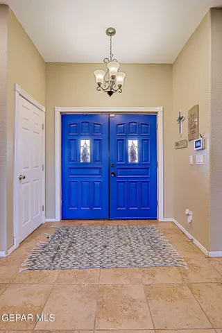 a living room with furniture and a bookshelf
