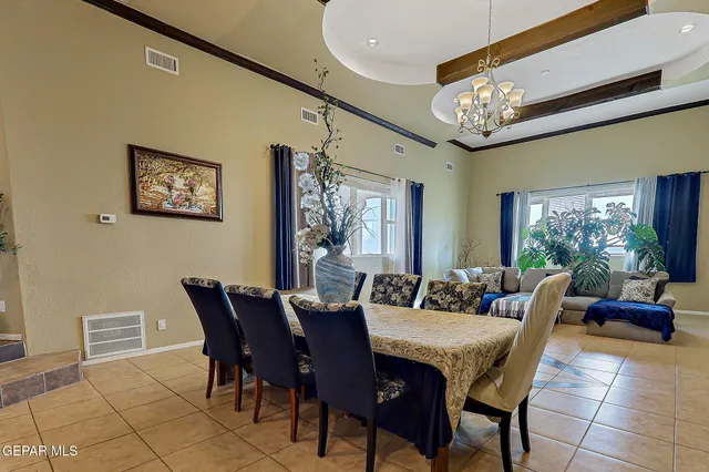 a kitchen with a table and chairs