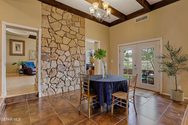 a kitchen with stainless steel appliances granite countertop a sink a stove and cabinets
