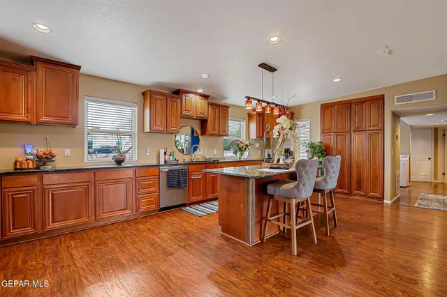 a bathroom with a sink a mirror and shower