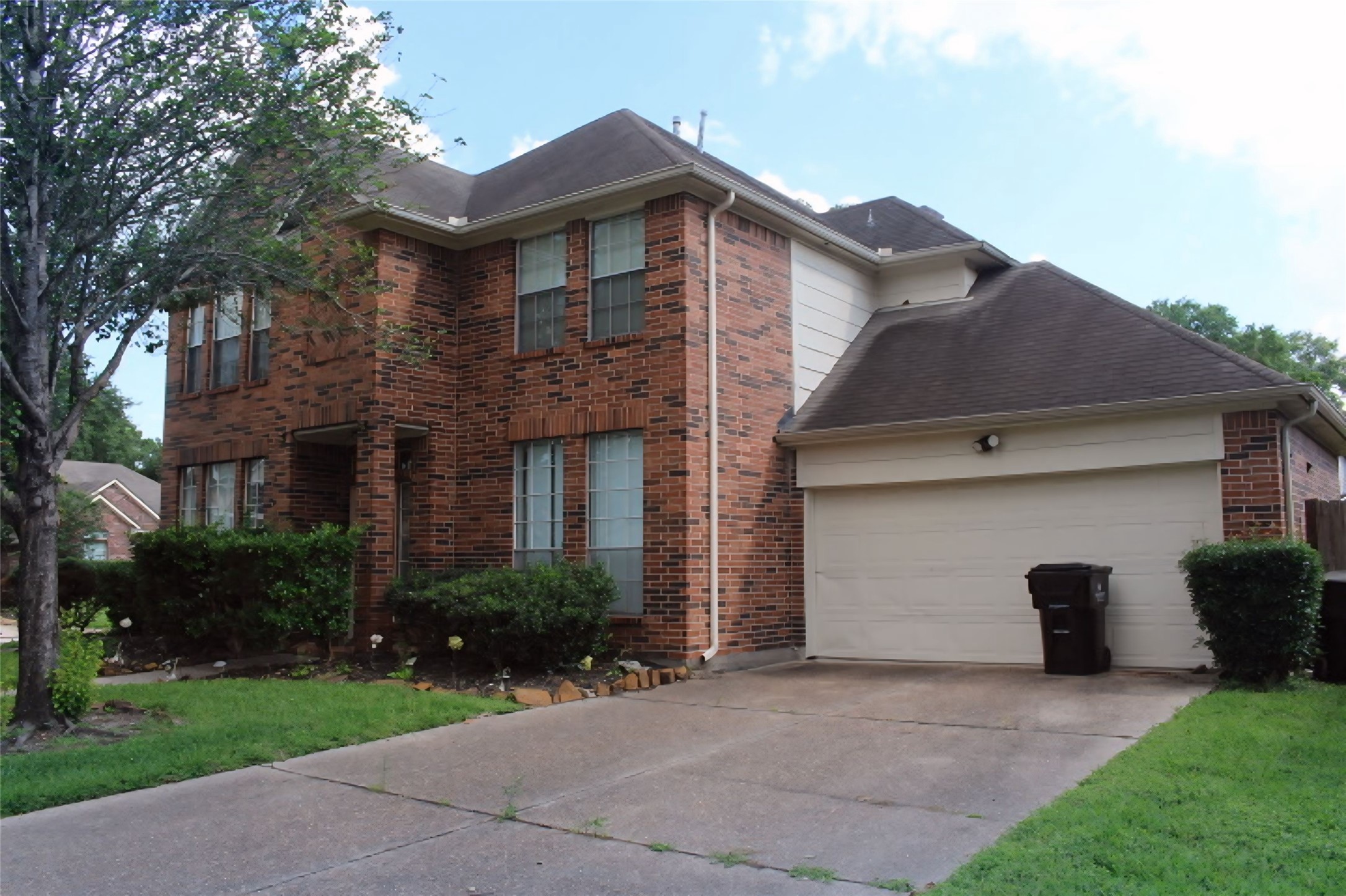 4103 Sablemist Court Houston, TX 77014 - Photo 1 of 29 a front view of a house with a yard and a garage