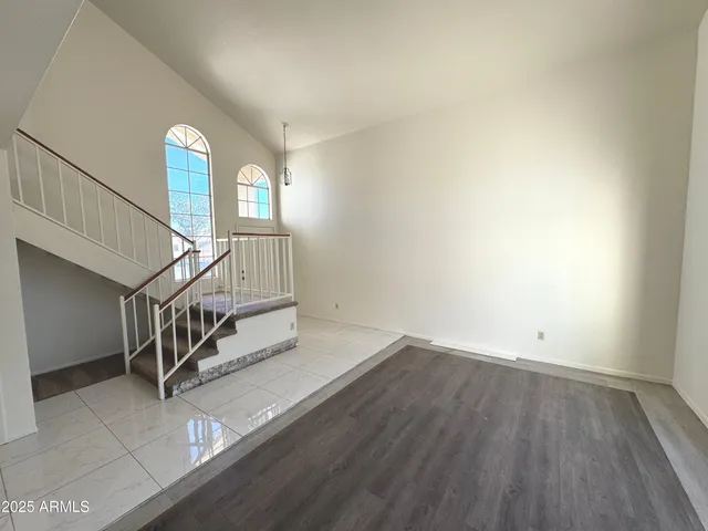 a view of an entryway with wooden floor