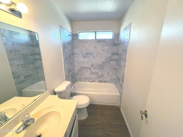 a bathroom with a bathtub and sink