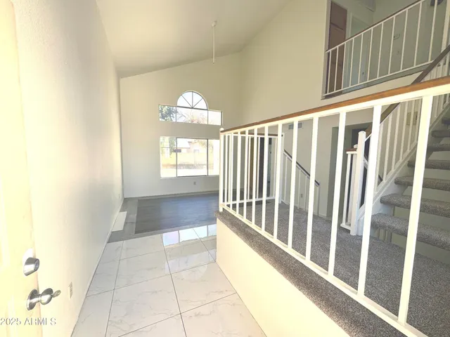 a view of entryway with stairs