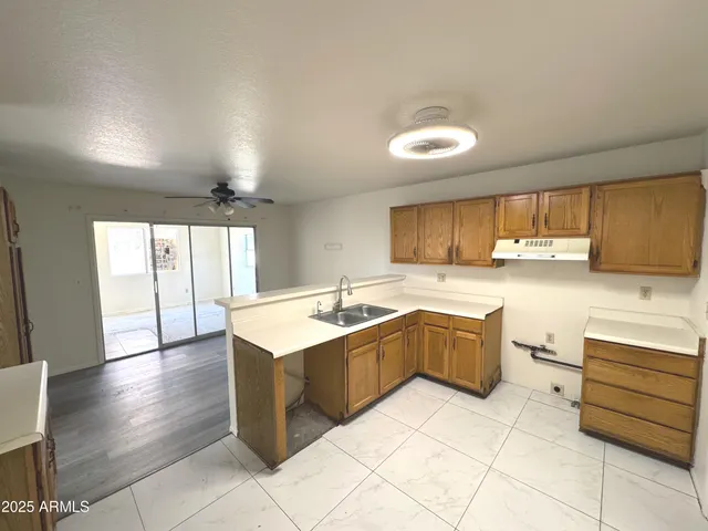 a kitchen with a sink and cabinets