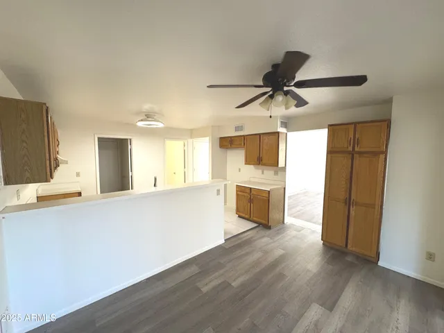 a view of a kitchen with a sink and a stove top oven