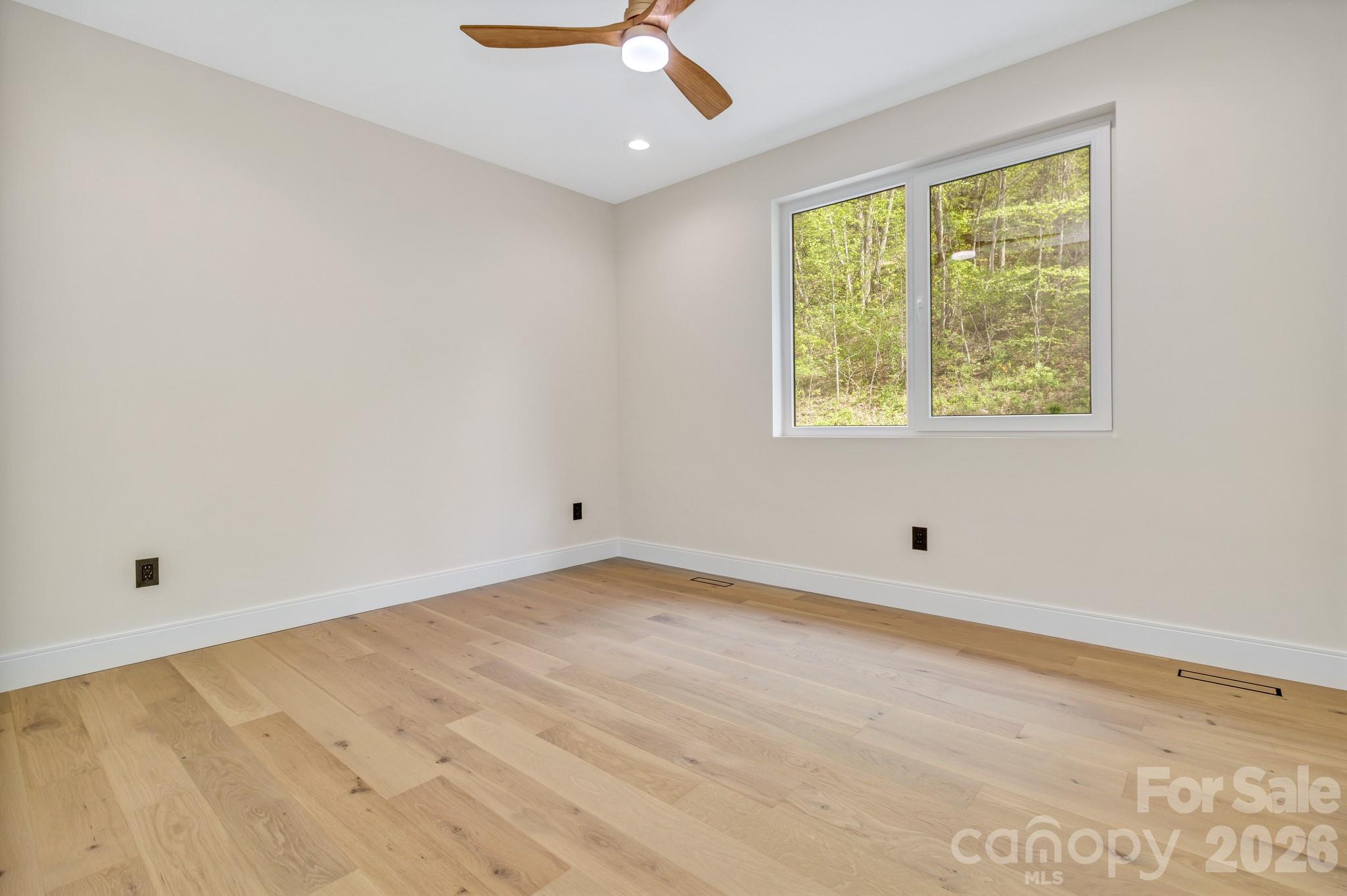 134 View Ridge Parkway Leicester, NC 28748 - Photo 38 of 48 a view of an empty room with a window