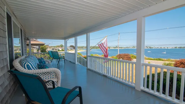 a view of a house that has a lot of flower plants