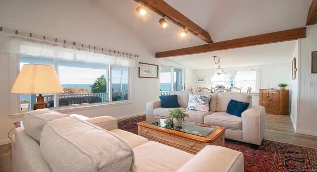 a view of kitchen with furniture and a potted plant