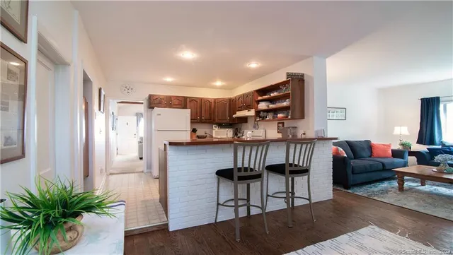 a room with furniture and wooden floor