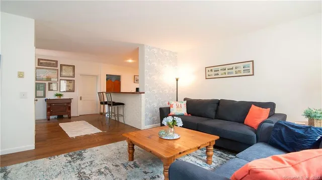 a view of a workspace with furniture and window