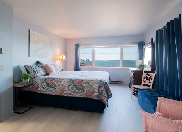 an aerial view of a house with a yard and tree s