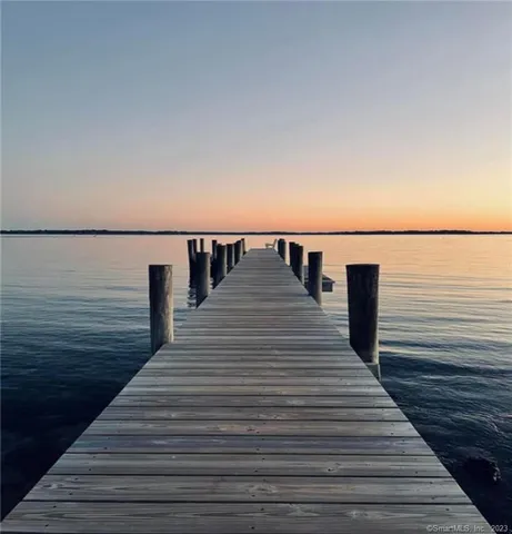 a view of a lake in front of residential houses