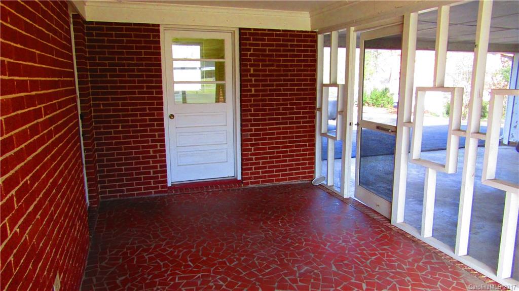 4901 Cheviot Road Charlotte, NC 28269 - Photo 20 of 23 a view of a porch with a floor to ceiling window