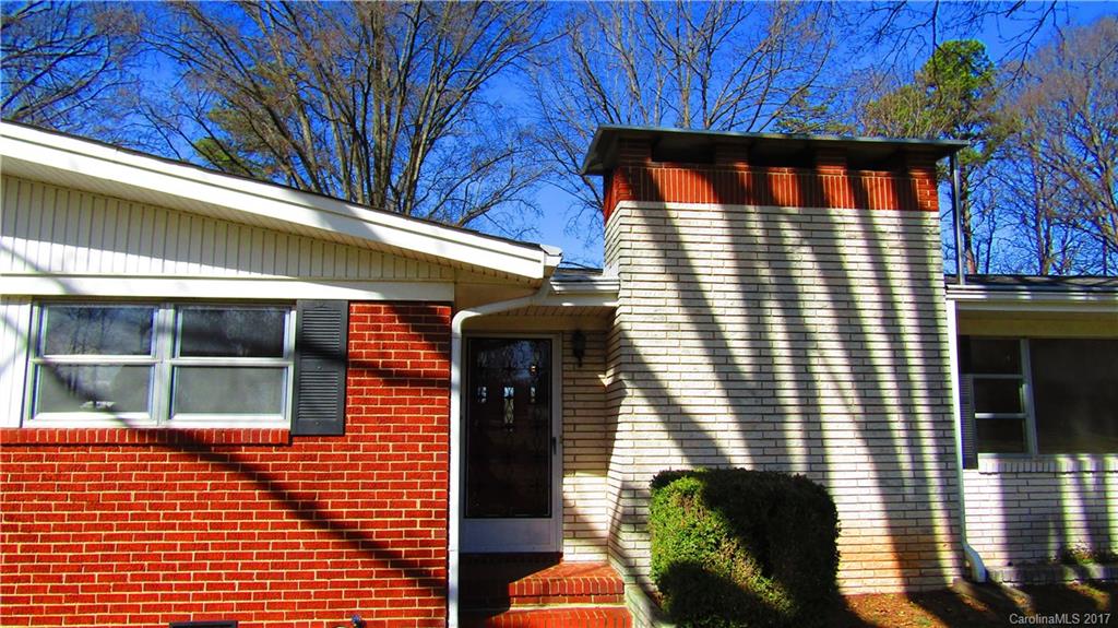 4901 Cheviot Road Charlotte, NC 28269 - Photo 3 of 23 a view of brick building with large windows
